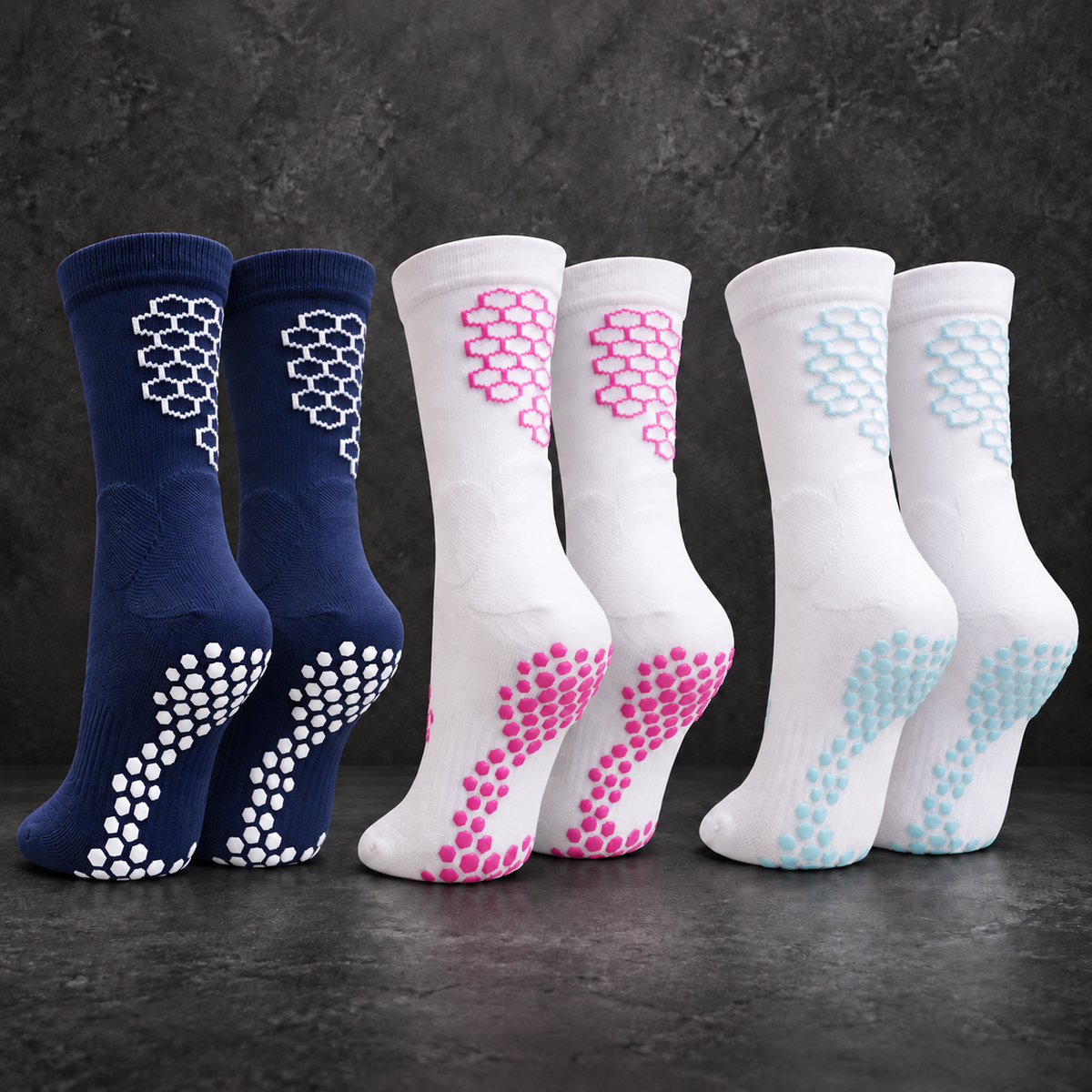 Three pairs of SOCKA grip socks in navy/white, white/pink and white/baby blue.
